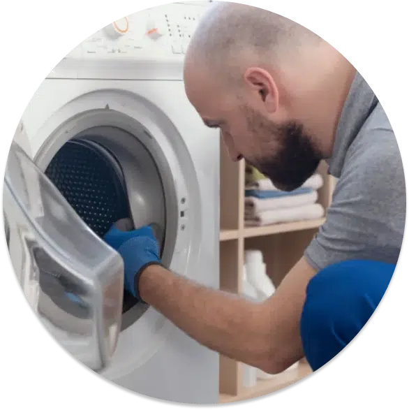 A contractor fixing a laundry machine