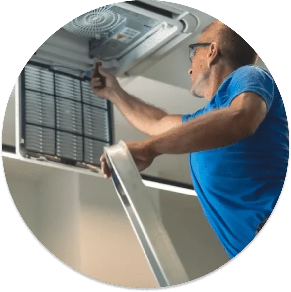 A contractor fixing the hvac system on a San Diego rental home